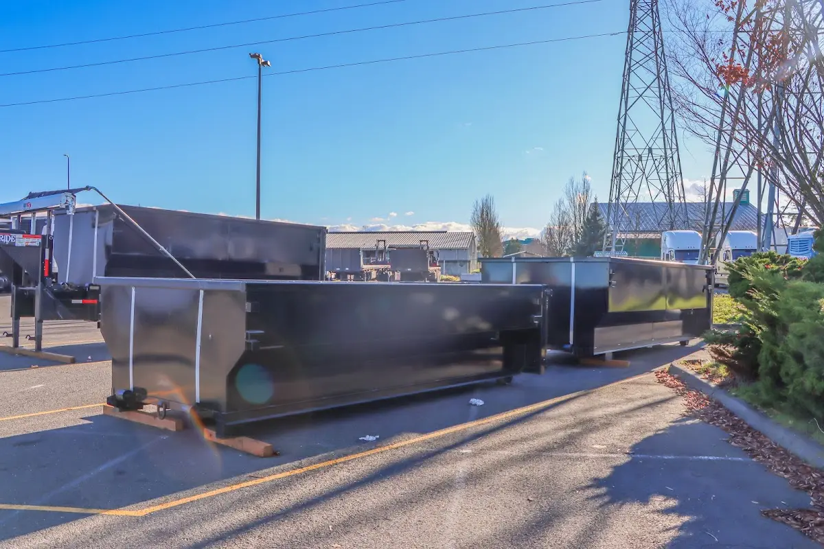 Roll-off dumpster ready for waste disposal at job site for Demolition Dumpster Rental in Battlefield